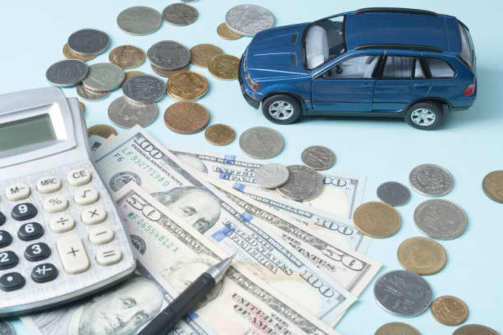 toy car calculator and money loan insurance and savings concept